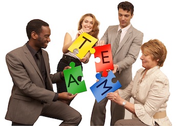 Team solving a puzzle that says "team".