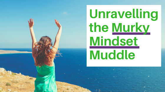 Happy woman looking out over the sea thrusts her hands in the air. "Unravelling the murky mindset muddle".